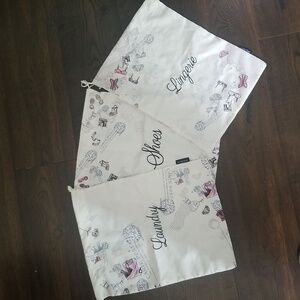 NWOT set of travel bags from Lancome, pink and black